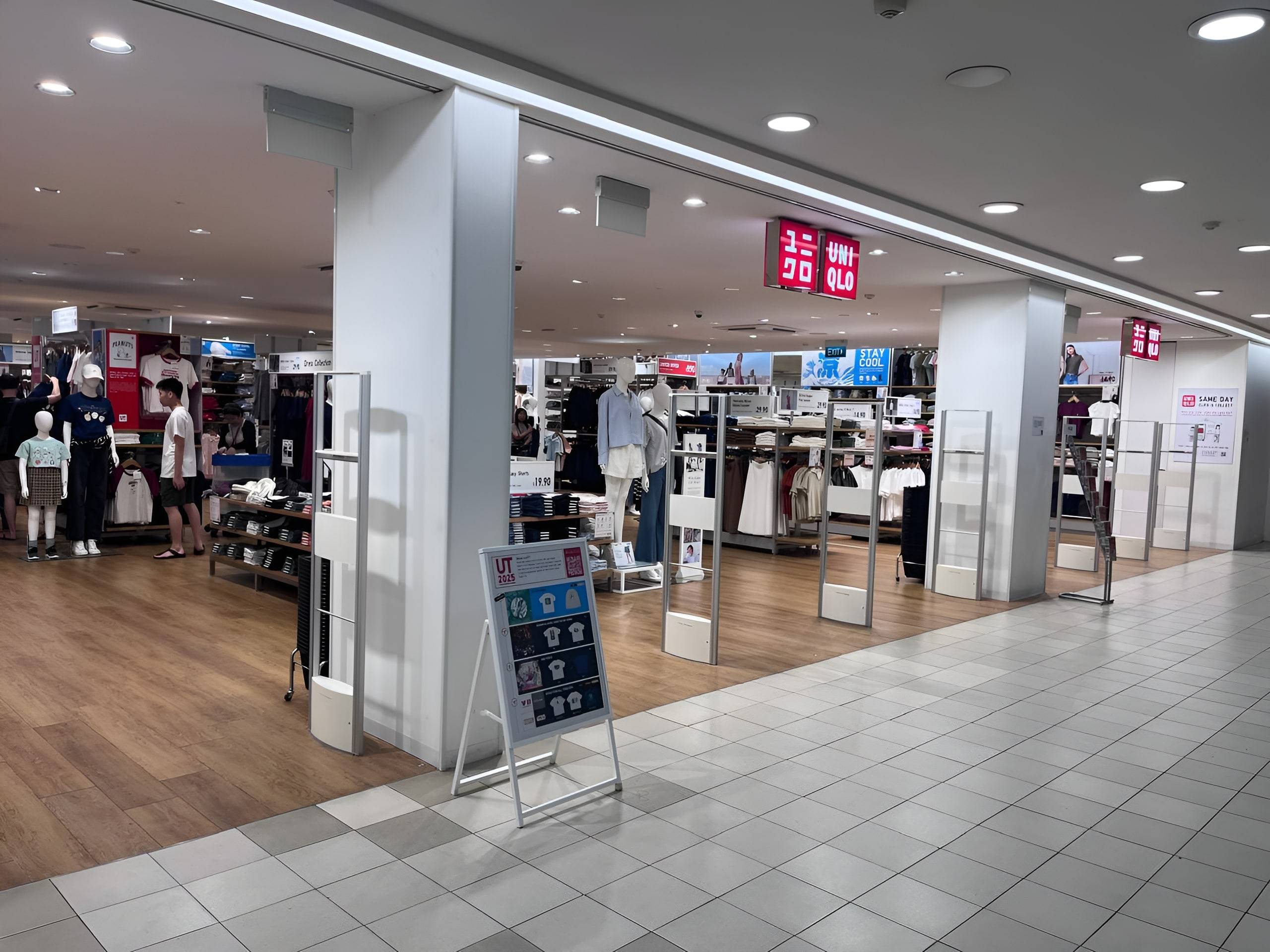 UNIQLO retail store fitout with modern fixtures and lighting in Singapore shopping mall